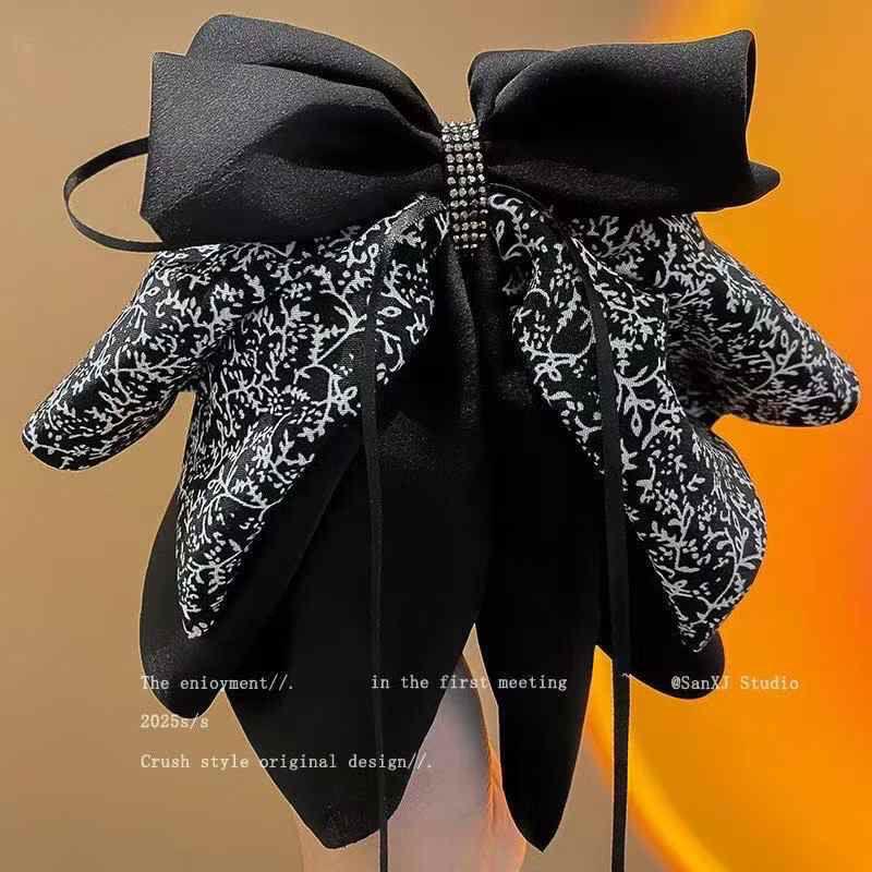 Elegant Black & White Floral Layered Bow Hair Clip with Crystal Accent