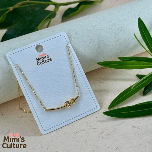 Mimi’s Golden Knot Charm Pendant 🎀